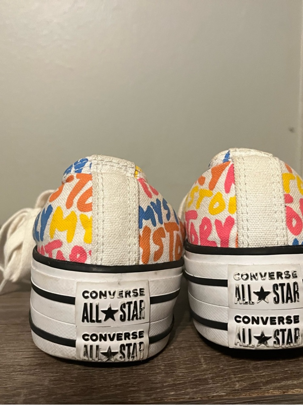 Converse White Low Top Sneakers with Yellow Orange Pink and Blue Print